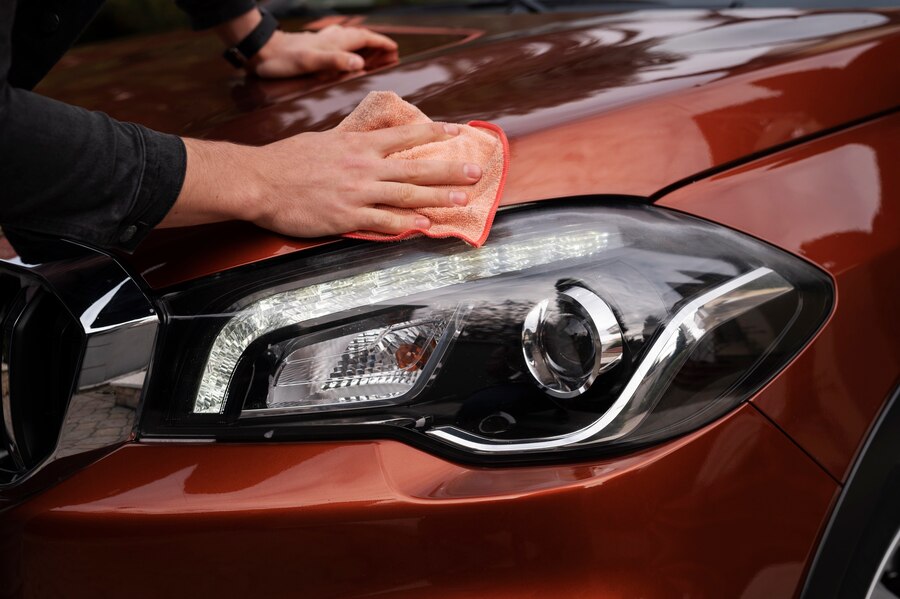close-up-car-care-process_23-2149193155 Detailing car finish for long-lasting protection