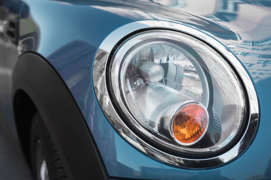 led-headlight-blue-auto_23-2147963002 Man washing car with high-pressure sprayer